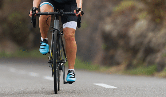 Atstock Productions/Bigstock.com Woman cycling outdoors demonstrating athletic performance