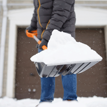 Healthy man shoveling snow in Clifton, NJ
