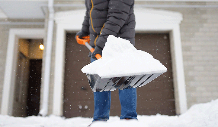 Healthy man shoveling snow in Clifton, NJ